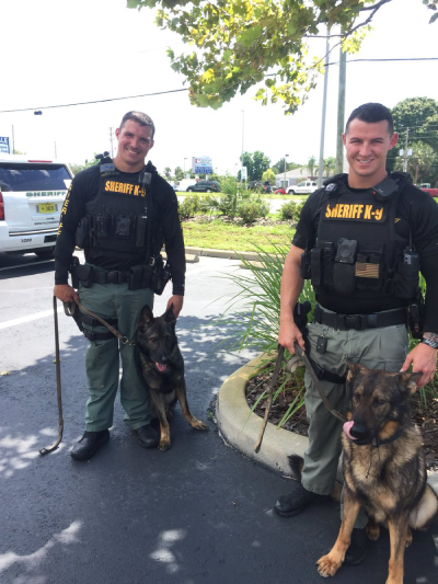 K9 Shep and K9 Yogi with their handlers